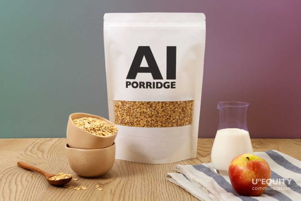 a table with a case of porridge named AI porridge, a spoon, some milk, sugar, and an apple